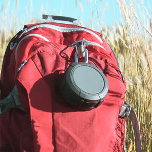 Omnigates Aeon Bluetooth Speaker POD clipped onto a backpack 